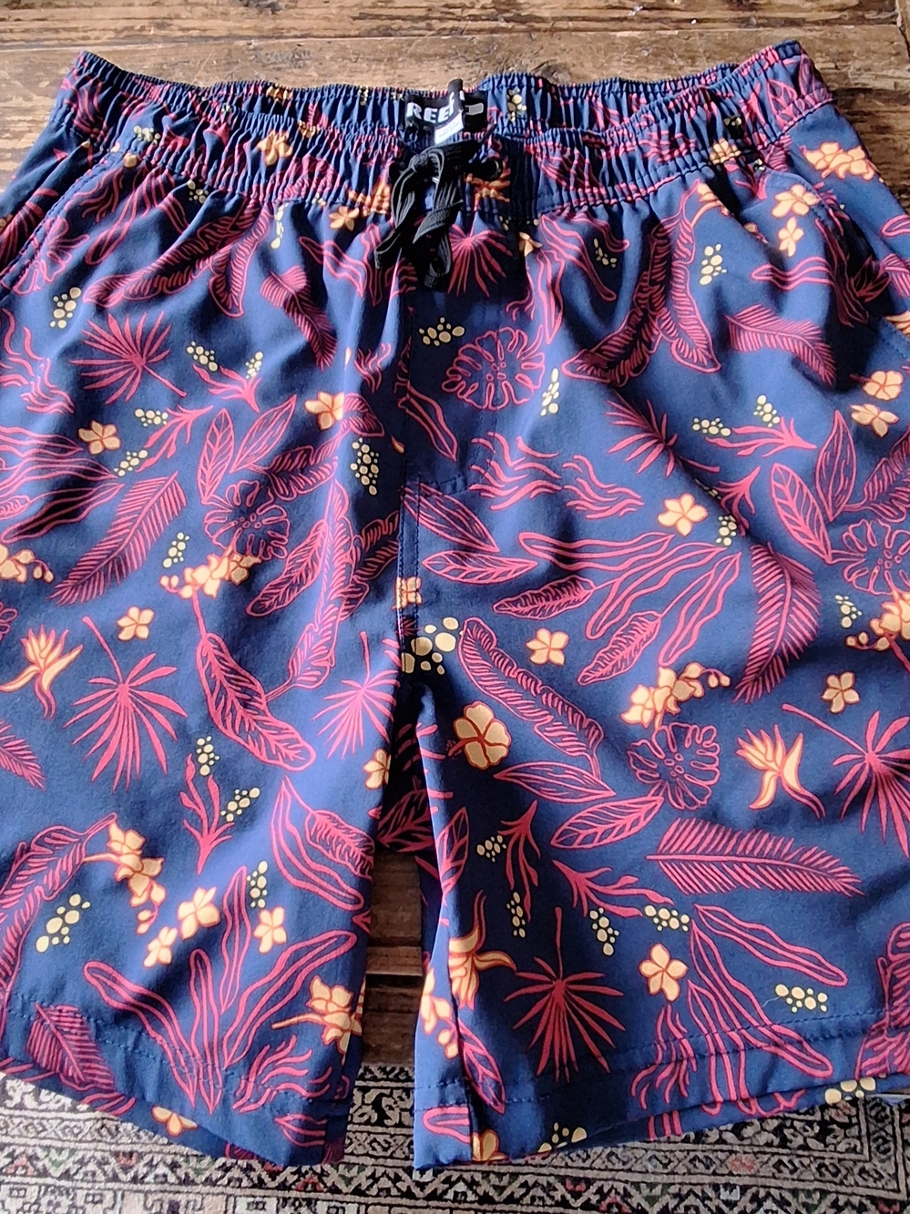 Reef Navy Swim Shorts with Red Floral and Yellow Dot Accents Small